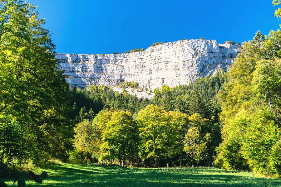 The limestone cliffs of the Creux du Van rock amphitheatre in autumn