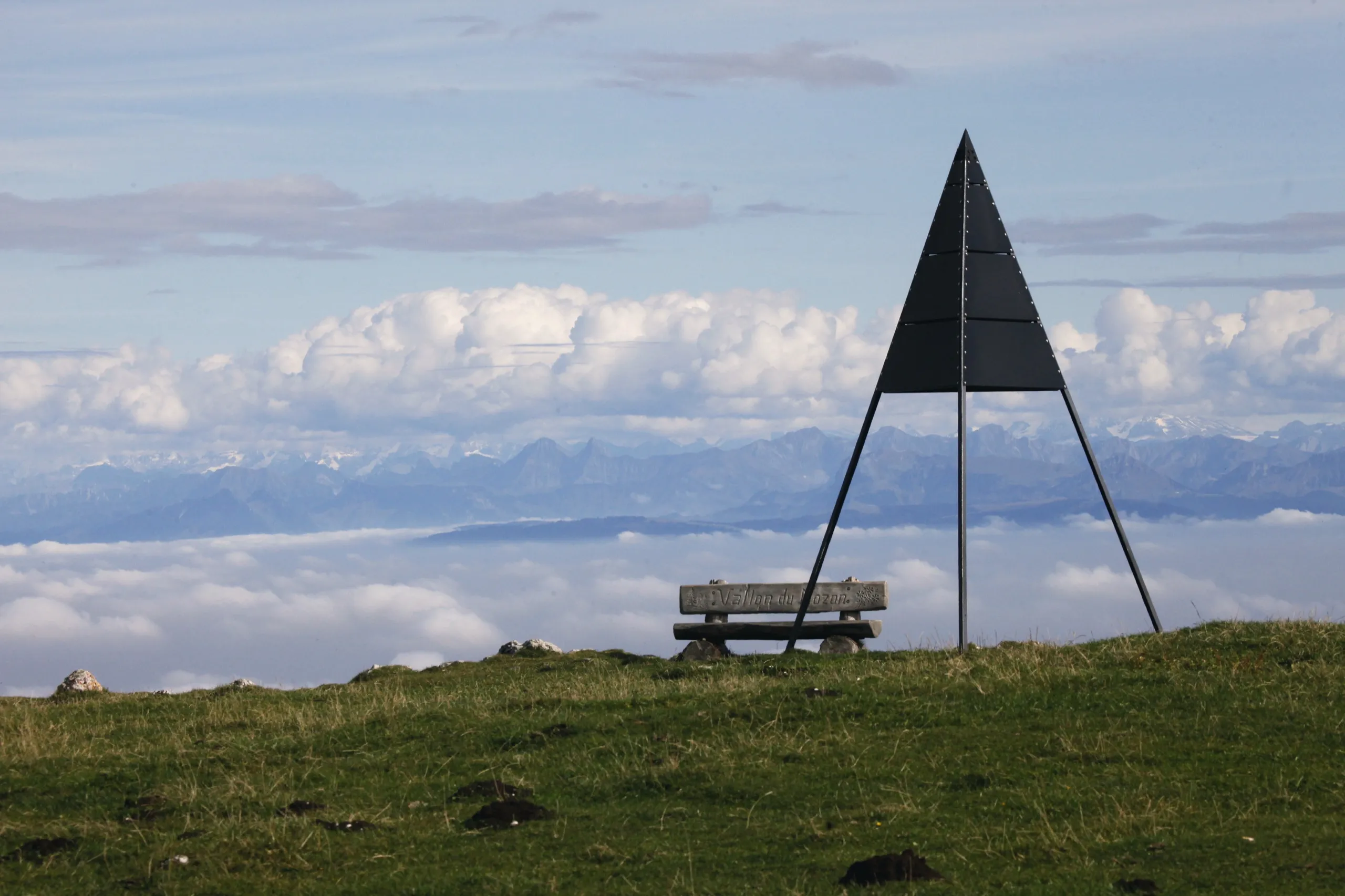 The summit of the Dent de Vaulion, the Alps beyond a sea of cloud