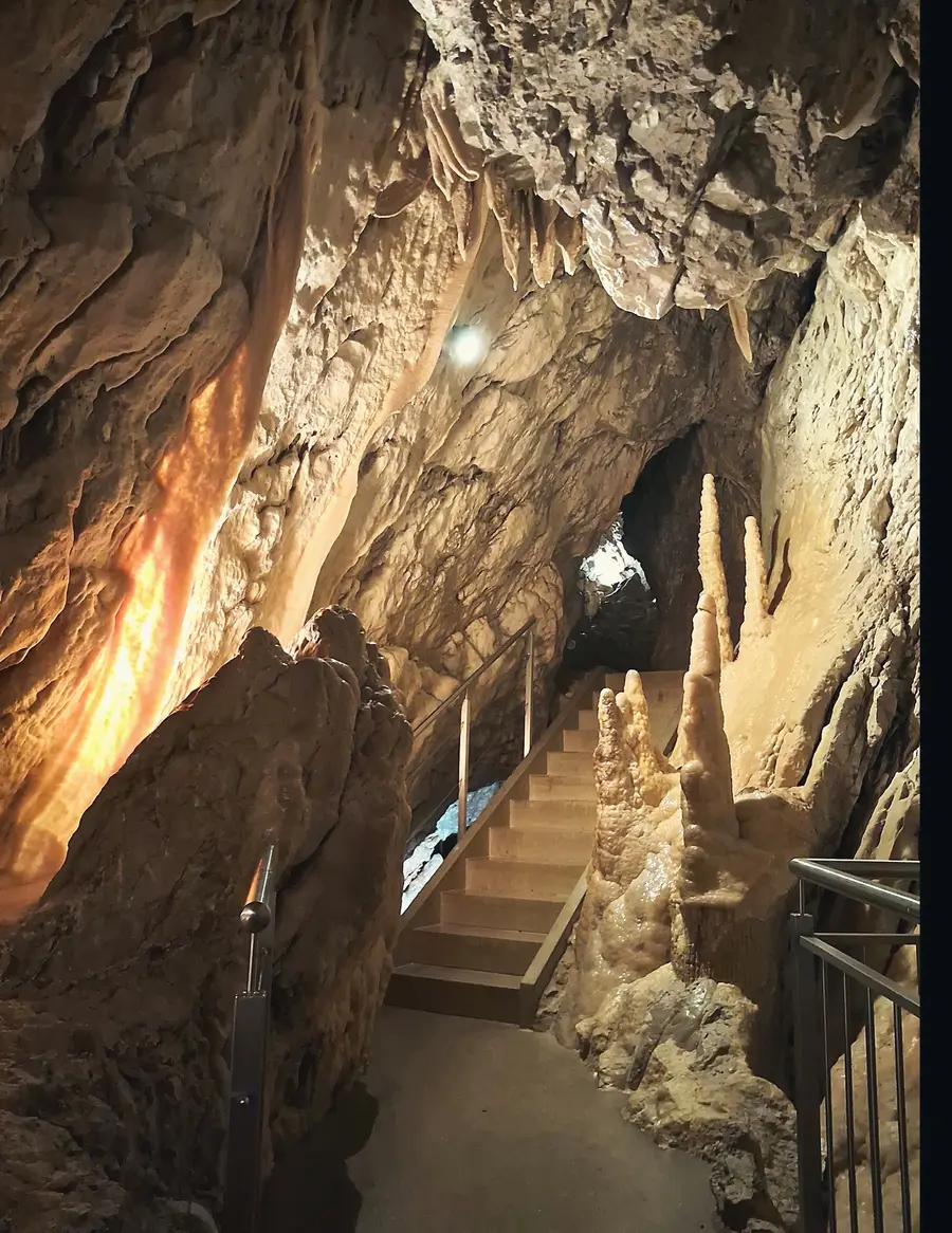 The stairway through the Grottes de Vallorbe, past the stalagmites